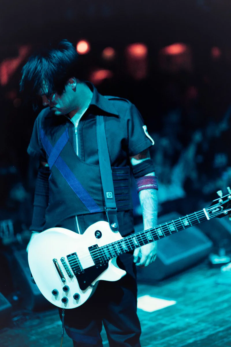 On stage playing guitar